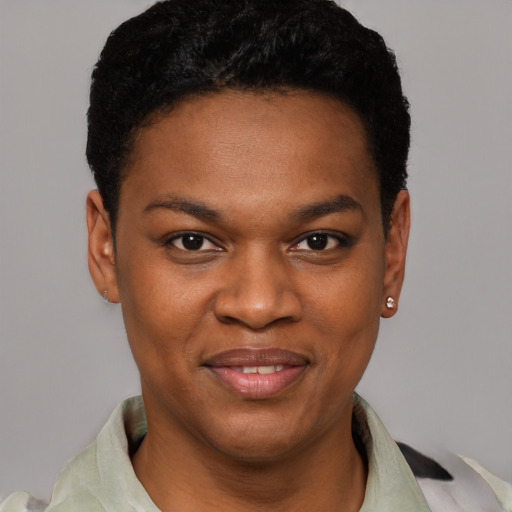 Joyful black young-adult female with short  black hair and brown eyes