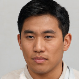 Neutral asian young-adult male with short  black hair and brown eyes