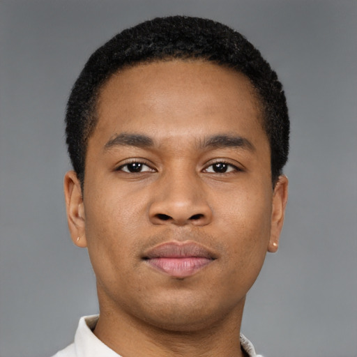 Neutral latino young-adult male with short  brown hair and brown eyes