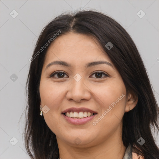 Joyful asian young-adult female with long  brown hair and brown eyes