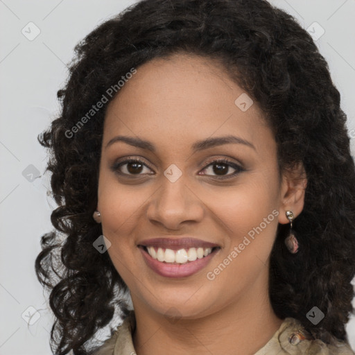 Joyful black young-adult female with long  brown hair and brown eyes