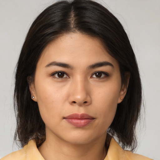 Neutral asian young-adult female with medium  brown hair and brown eyes