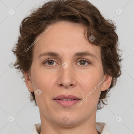 Joyful white adult female with short  brown hair and brown eyes