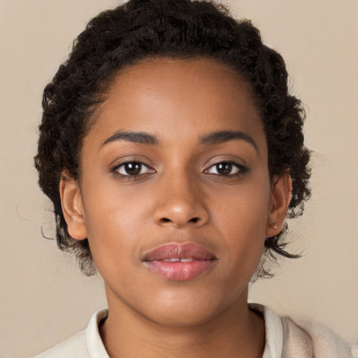 Neutral black young-adult female with short  brown hair and brown eyes