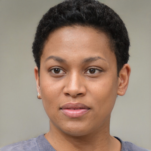 Joyful black young-adult female with short  brown hair and brown eyes