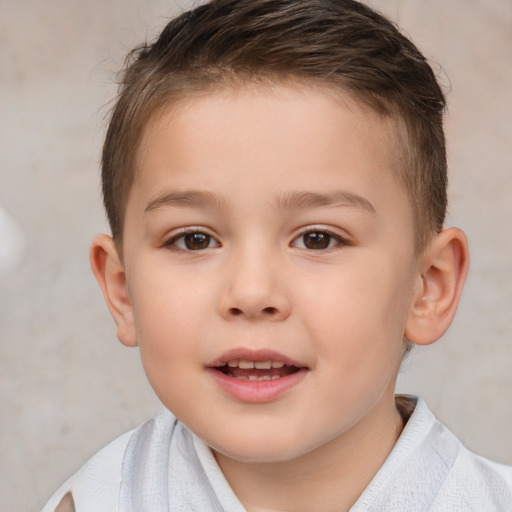 Joyful white child male with short  brown hair and brown eyes