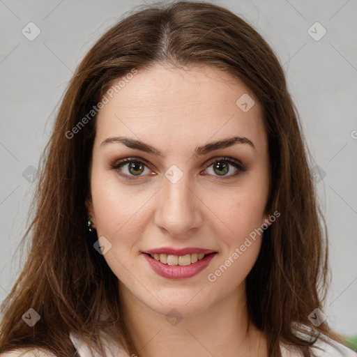 Joyful white young-adult female with long  brown hair and green eyes