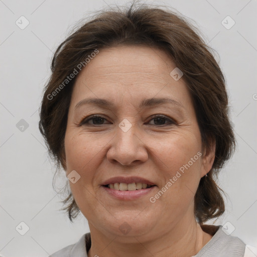 Joyful white adult female with medium  brown hair and brown eyes