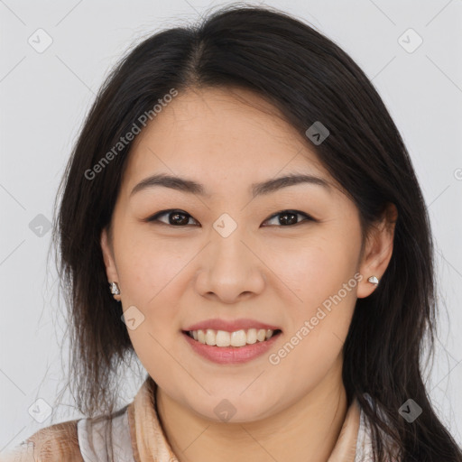 Joyful asian young-adult female with long  brown hair and brown eyes