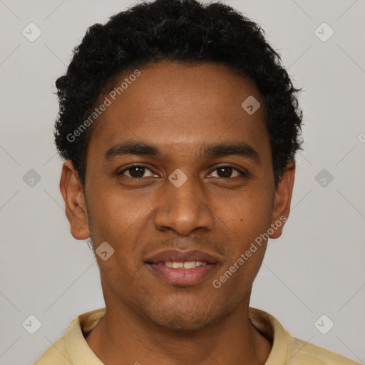 Joyful black young-adult male with short  brown hair and brown eyes