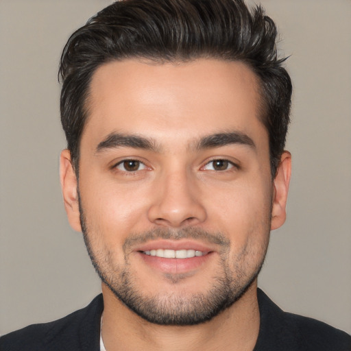 Joyful white young-adult male with short  black hair and brown eyes