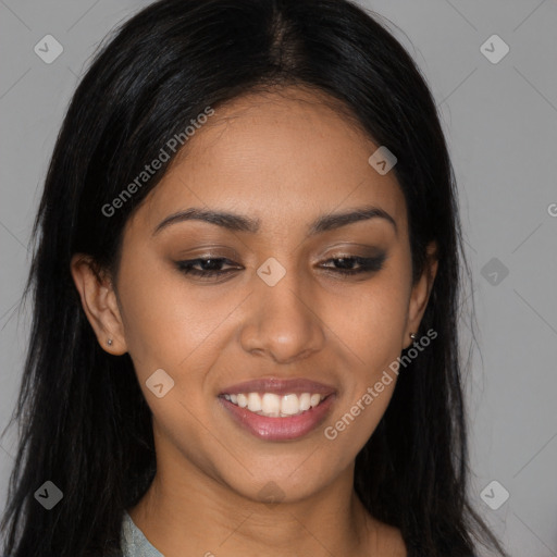 Joyful latino young-adult female with long  black hair and brown eyes