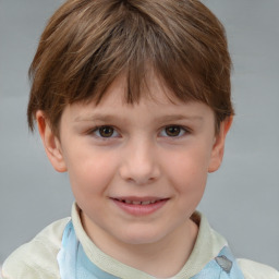 Joyful white child male with short  brown hair and brown eyes