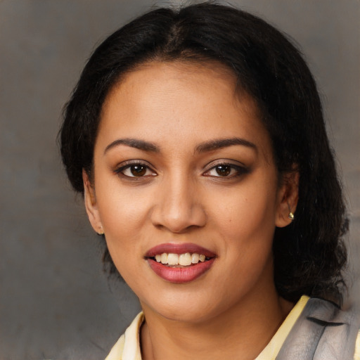 Joyful latino young-adult female with medium  black hair and brown eyes