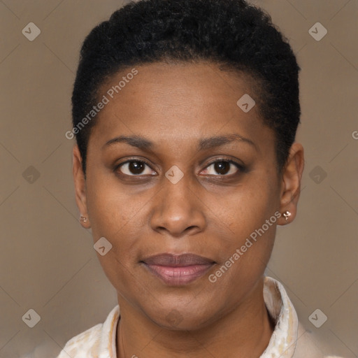 Joyful black adult female with short  brown hair and brown eyes