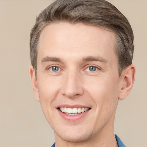 Joyful white adult male with short  brown hair and grey eyes