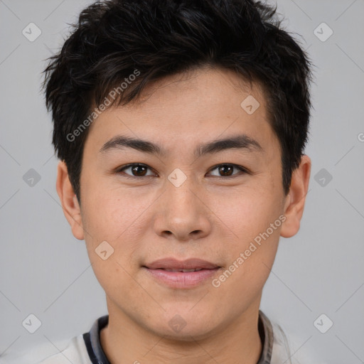 Joyful asian young-adult male with short  brown hair and brown eyes