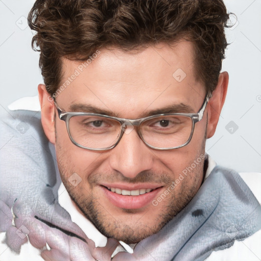 Joyful white adult male with short  brown hair and blue eyes