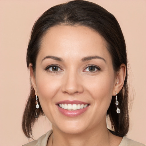 Joyful white young-adult female with medium  brown hair and brown eyes