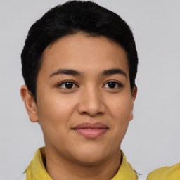 Joyful latino young-adult female with short  black hair and brown eyes