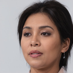 Neutral white young-adult female with medium  brown hair and brown eyes