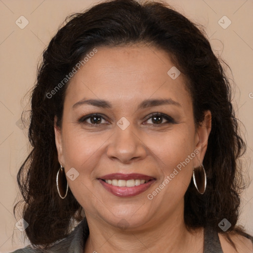 Joyful white adult female with long  brown hair and brown eyes