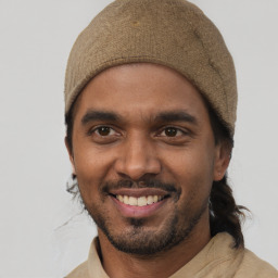 Joyful white young-adult male with short  black hair and brown eyes