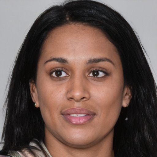 Joyful white young-adult female with long  black hair and brown eyes