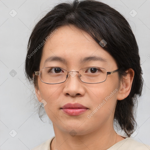 Joyful white adult female with medium  brown hair and brown eyes