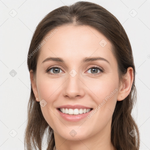 Joyful white young-adult female with long  brown hair and grey eyes