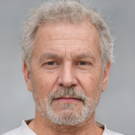 Neutral white middle-aged male with short  gray hair and brown eyes