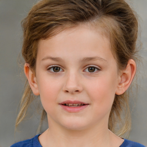 Joyful white child female with medium  brown hair and grey eyes