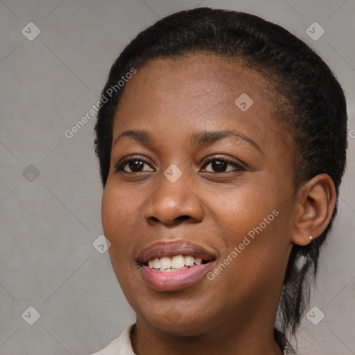 Joyful black young-adult female with medium  black hair and brown eyes