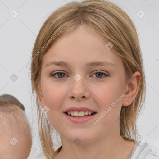 Joyful white child female with medium  brown hair and brown eyes