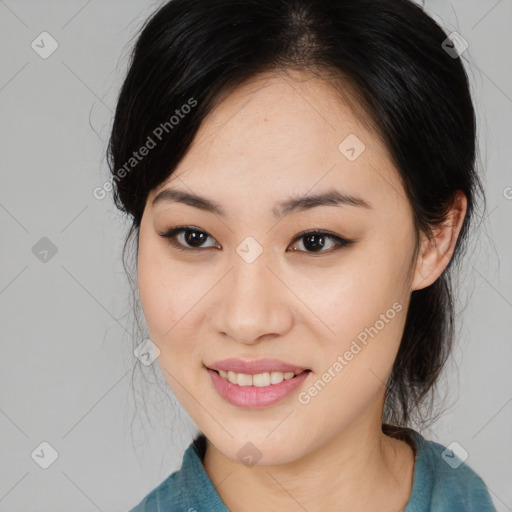 Joyful asian young-adult female with medium  black hair and brown eyes