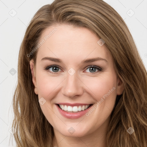 Joyful white young-adult female with long  brown hair and green eyes