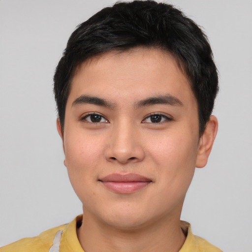 Joyful asian young-adult male with short  brown hair and brown eyes