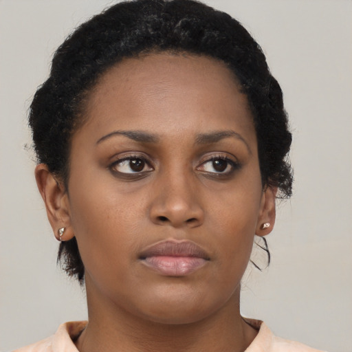 Neutral black young-adult female with short  brown hair and brown eyes