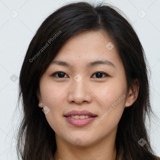 Joyful asian young-adult female with long  brown hair and brown eyes