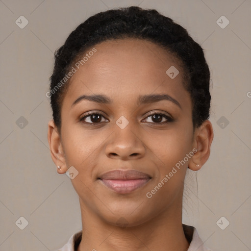 Joyful black young-adult female with short  black hair and brown eyes