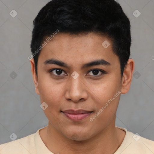 Joyful latino young-adult male with short  black hair and brown eyes