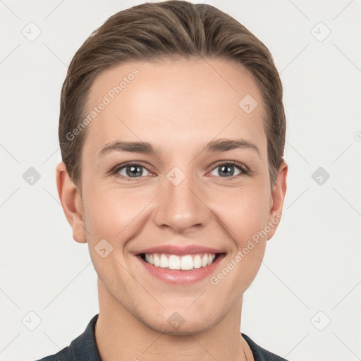 Joyful white young-adult female with short  brown hair and grey eyes