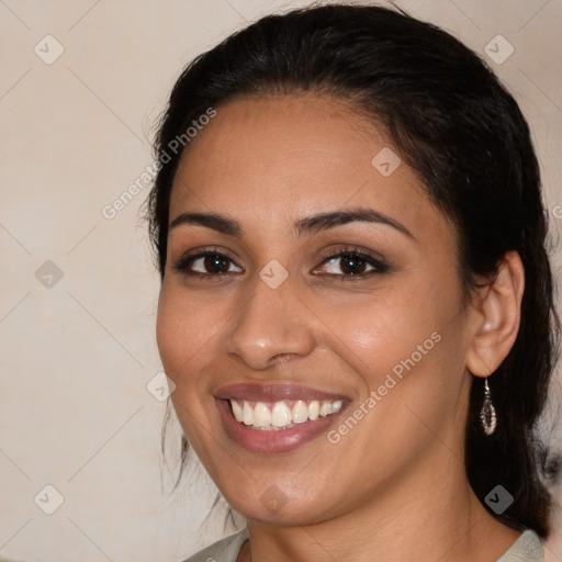 Joyful latino young-adult female with medium  brown hair and brown eyes