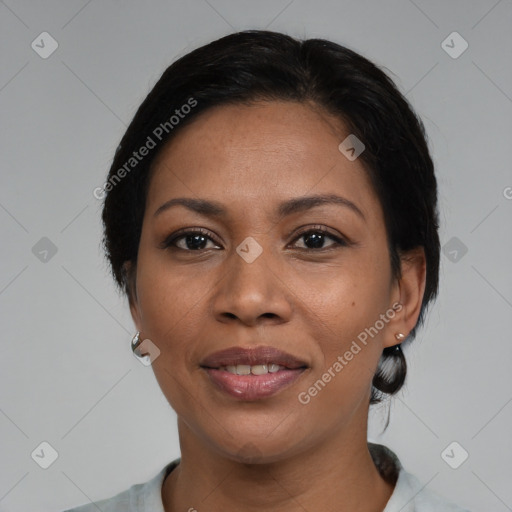 Joyful black adult female with medium  black hair and brown eyes