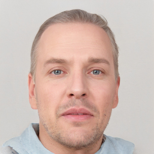 Neutral white adult male with short  brown hair and grey eyes