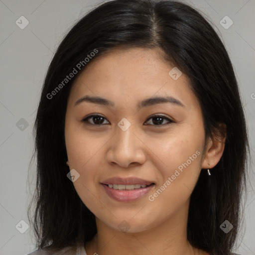 Joyful asian young-adult female with long  brown hair and brown eyes