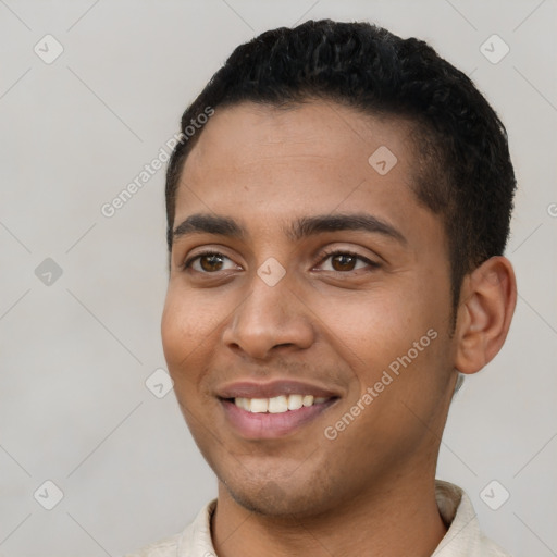 Joyful latino young-adult male with short  black hair and brown eyes