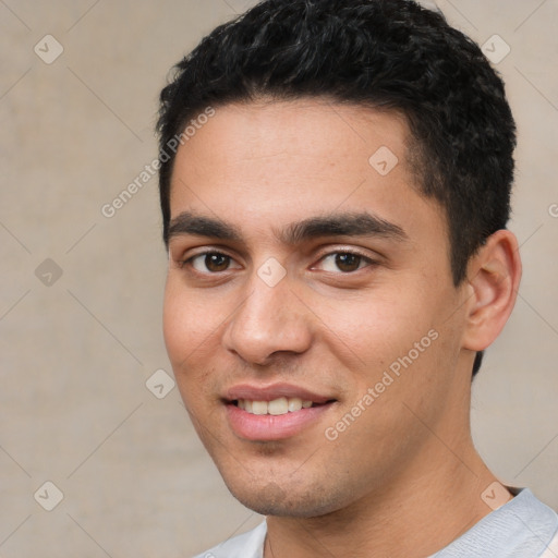 Joyful white young-adult male with short  black hair and brown eyes