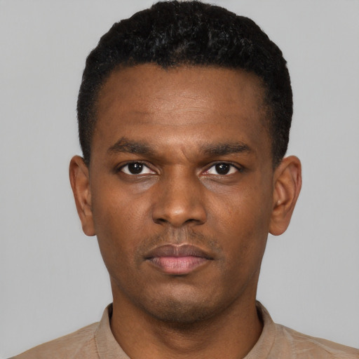 Neutral black young-adult male with short  black hair and brown eyes