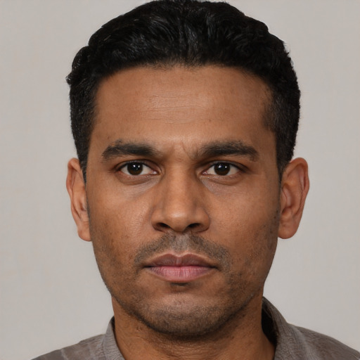 Neutral latino young-adult male with short  black hair and brown eyes